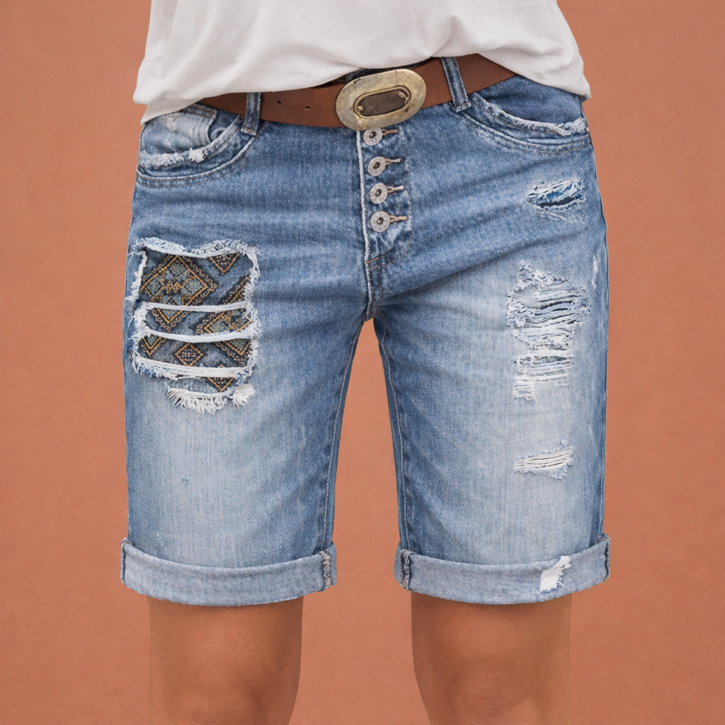 Stylish women's denim shorts with ripped details | Vayen