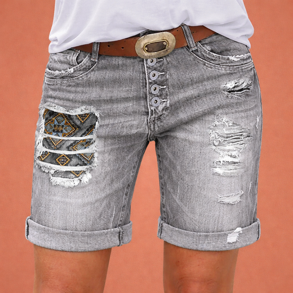 Stylish women's denim shorts with ripped details | Vayen