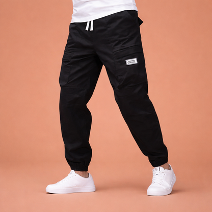 Corduroy pants with multiple pockets and elastic waist for men | Rik